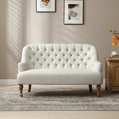 Shop the Bianca 2-Seater Chair, combining classic elegance with superior comfort. Featuring a plump seat, eye-catching tufted back, and traditional washed wooden legs. Shop online at www.nobleandnook.co.uk