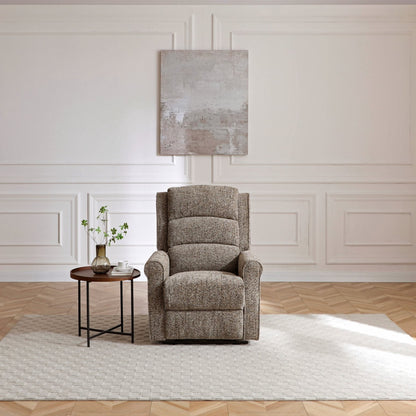 Gray armchair in a room with white walls and wooden floor.