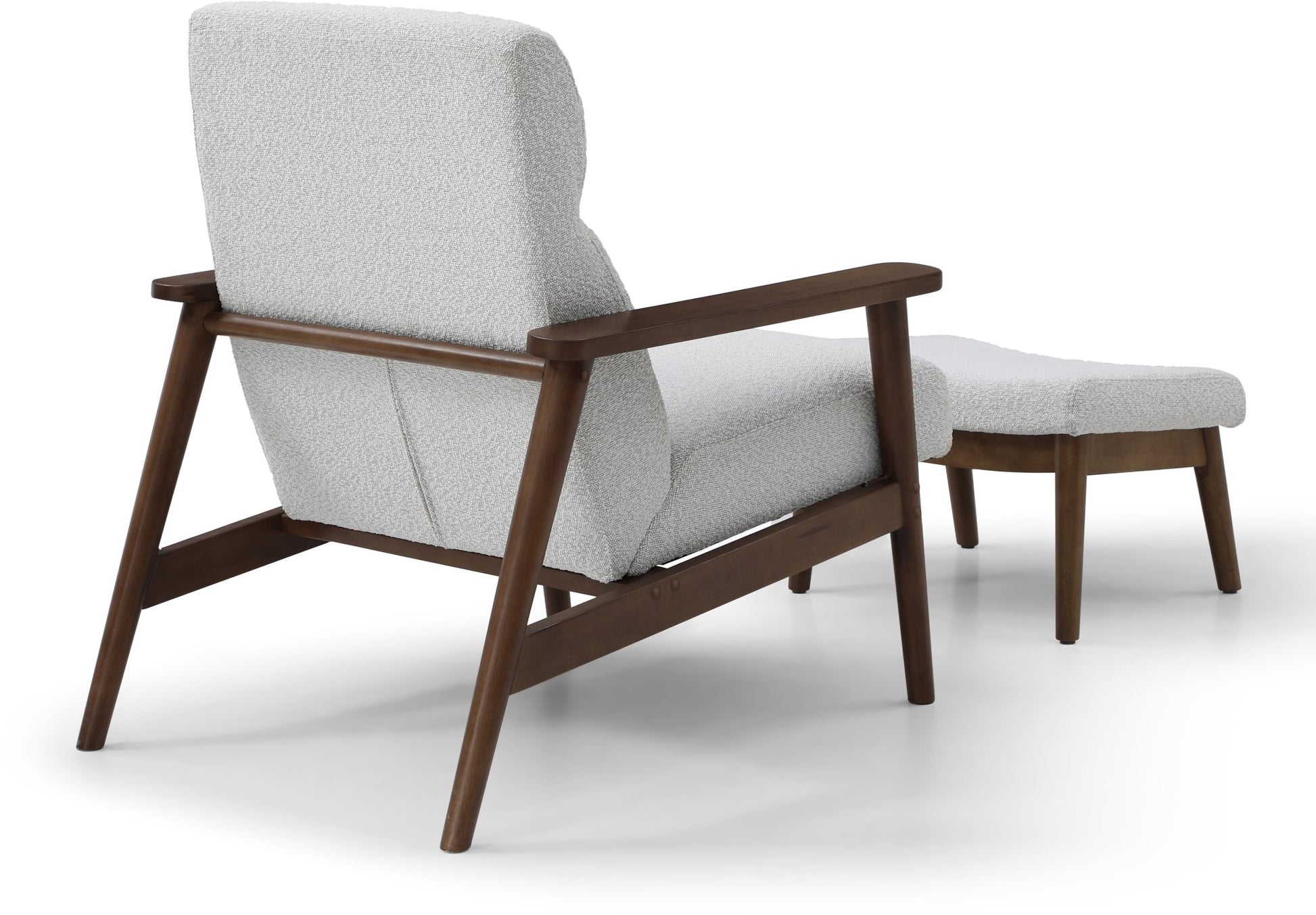 Ultimate comfort and timeless elegance, the Isaac Chair & Footstool, upholstered in luxurious natural bouclé, brings style and warmth to any space. Shop online today at www.nobleandnook.co.uk