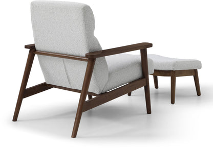 Ultimate comfort and timeless elegance, the Isaac Chair & Footstool, upholstered in luxurious natural bouclé, brings style and warmth to any space. Shop online today at www.nobleandnook.co.uk