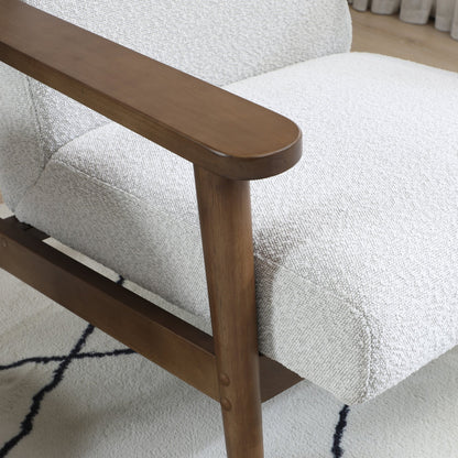 Ultimate comfort and timeless elegance, the Isaac Chair & Footstool, upholstered in luxurious natural bouclé, brings style and warmth to any space. Shop online today at www.nobleandnook.co.uk