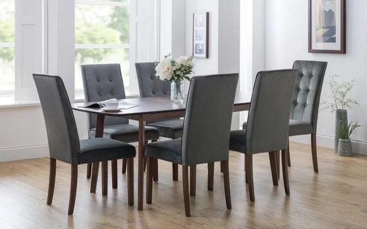 The Kensington Extending Dining Table combines timeless elegance with practical functionality, crafted from solid beech and beech veneers with a rich walnut finish. Shop online today at www.nobleandnook.co.uk