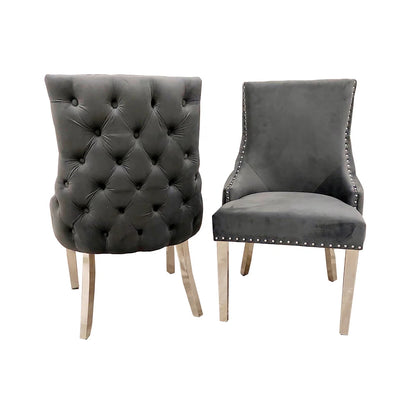 Elevate your dining experience with this exquisite pair of Kensington Velvet Dining Chairs in Dark Grey. Perfect for modern and classic interiors alike. Shop online today at www.nobleandnook.co.uk