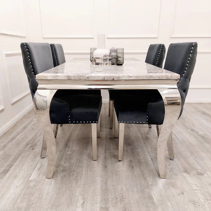 Elevate your dining experience with this exquisite pair of Kensington Velvet Dining Chairs in Dark Grey. Perfect for modern and classic interiors alike. Shop online today at www.nobleandnook.co.uk