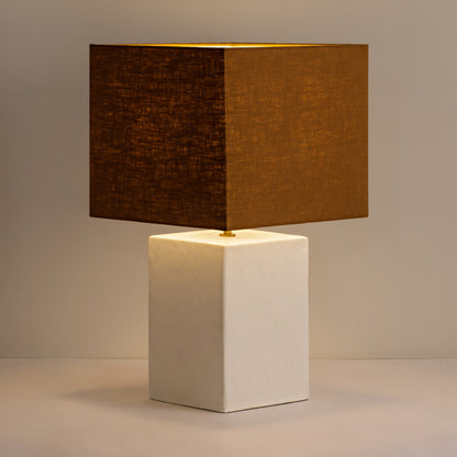 Small Rectangular Gesso Lamp with sculptural rectangular base. Perfect for smaller spaces, this lamp delivers ambient light while serving as a modern accent in any room. W31 x D31 x H55 cm Shop online now at www.nobleandnook.co.uk