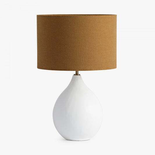 Shop the Small Round Gesso Lamp featuring a neutral taupe shade. A stylish piece that will add a touch of sophistication to any room. FREE UK MAINLAND DELIVERY. Shop online now at www.nobleandnook.co.uk