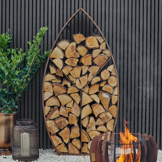 Shop the Leaf Arch Sculptural Log Storage in Natural Rust. This stylish and functional log storage solution adds a touch of elegance to any garden or patio. Shop online today at www.nobleandnook.co.uk