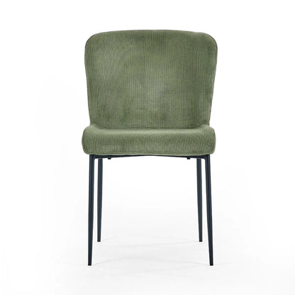 Shop the Leonie Dining Chair in green velvet and bring a sophisticated statement to your dining space. Featuring a plush, curved design and slender black legs. Shop online today at www.nobleandnook.co.uk