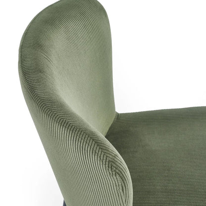 Shop the Leonie Dining Chair in green velvet and bring a sophisticated statement to your dining space. Featuring a plush, curved design and slender black legs. Shop online today at www.nobleandnook.co.uk