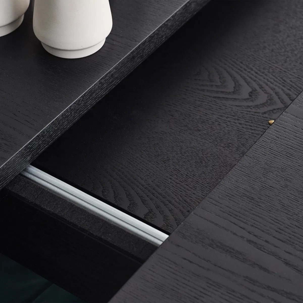Elevate your dining area with the Louis Fluted Extending Dining Table, a modern masterpiece finished in luxurious matt black. Adjusts from W180cm to W220cm to seat 6 people comfortably. Shop online today at www.nobleandnook.co.uk