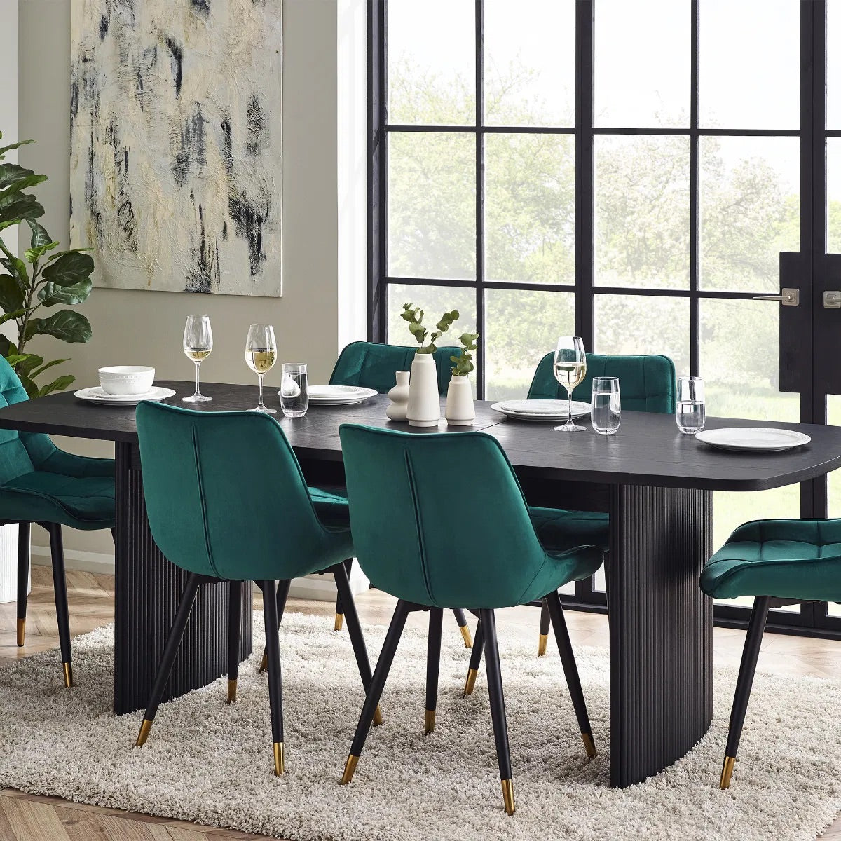 Elevate your dining area with the Louis Fluted Extending Dining Table, a modern masterpiece finished in luxurious matt black. Adjusts from W180cm to W220cm to seat 6 people comfortably. Shop online today at www.nobleandnook.co.uk