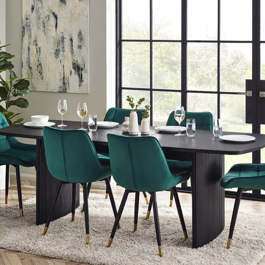 Elevate your dining area with the Louis Fluted Extending Dining Table, a modern masterpiece finished in luxurious matt black. Adjusts from W180cm to W220cm to seat 6 people comfortably. Shop online today at www.nobleandnook.co.uk
