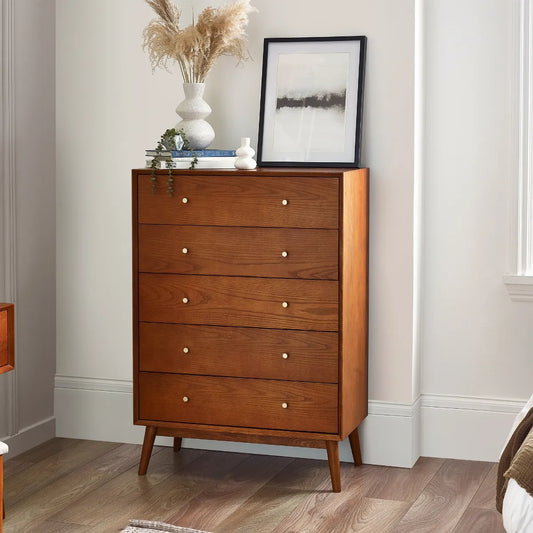 Shop the retro-inspired of the Lowry 5 Drawer Chest.  A gorgeous timeless design in cherry ash wood veneer with gold handles. Shop online now at www.nobleandnook.co.uk