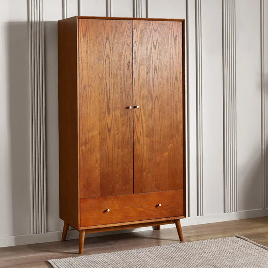 Shop the gorgeous retro-inspired Lowry double wardrobe with lower drawer, constructed from exquisite cherry ash wood. A perfect timeless staple to any bedroom space. Shop online now at www.nobleandnook.co.uk
