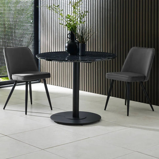 The Luca Black Round Dining Table is the perfect centrepiece for contemporary living with a black marble-effect top and contrasting black pedestal base. Dimensions H75xW80. Basic Assembly Required. Available today at www.nobleandnook.co.uk