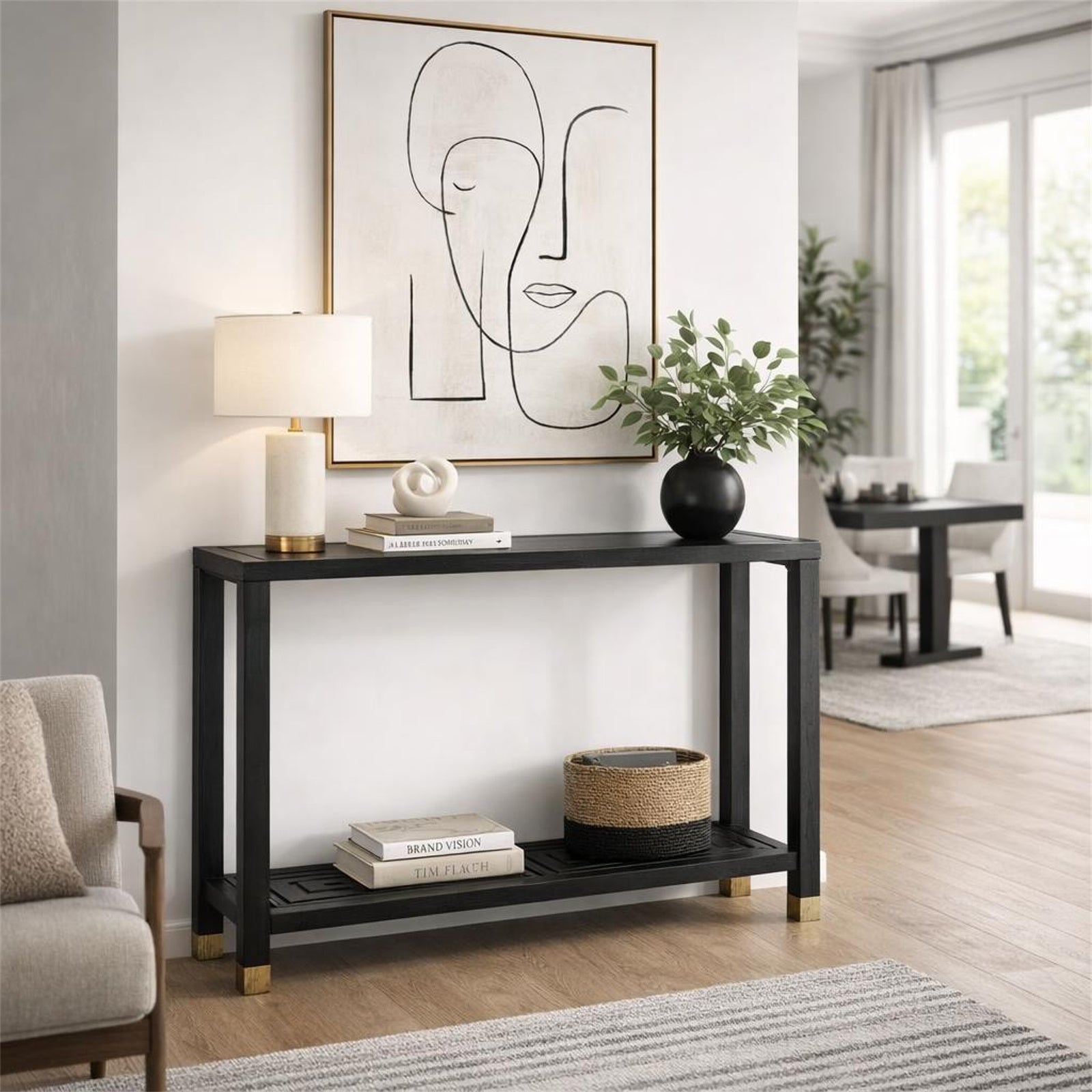 Modern living room with a black console table, abstract art, and decor items.