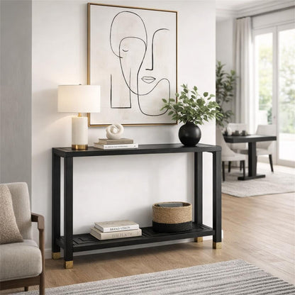 Modern living room with a black console table, abstract art, and decor items.