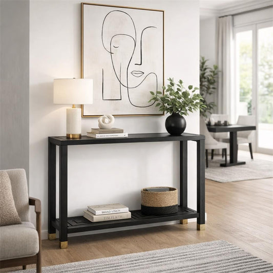 Modern living room with a black console table, abstract art, and decor items.