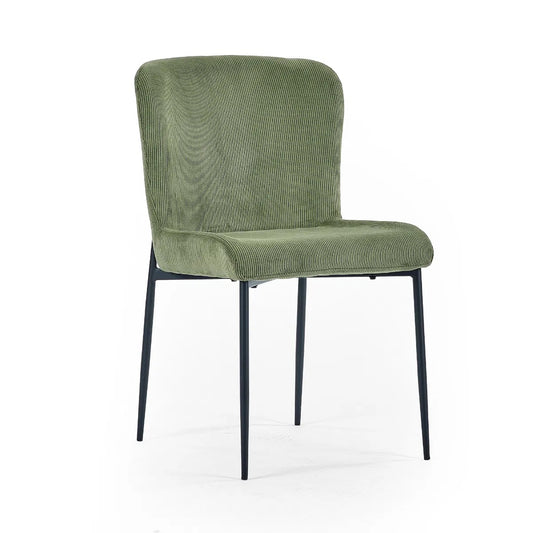 Shop the Leonie Dining Chair in green velvet and bring a sophisticated statement to your dining space. Featuring a plush, curved design and slender black legs. Shop online today at www.nobleandnook.co.uk