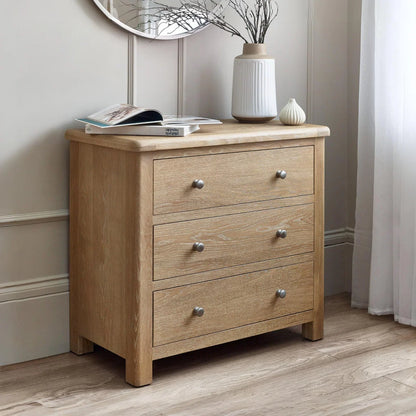 Wooden dresser with three drawers in a room setting