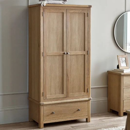 Shop the Memphis double Wardrobe with lower drawer. Finished in exquisite limed oak with gracefully curved edging, this wardrobe is a statement piece. Shop online today at www.nobleandnook.co.uk