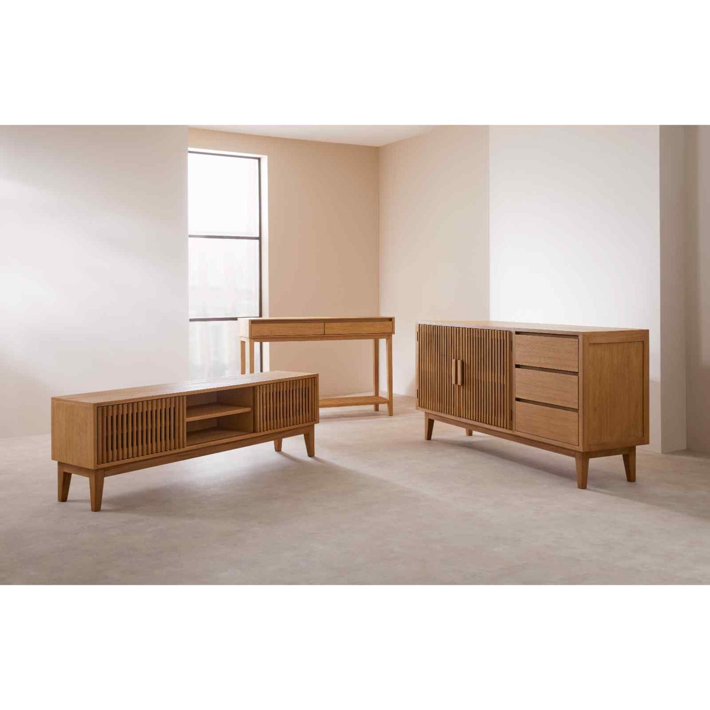 Wooden furniture pieces including a sideboard and two tables in a minimalistic room.