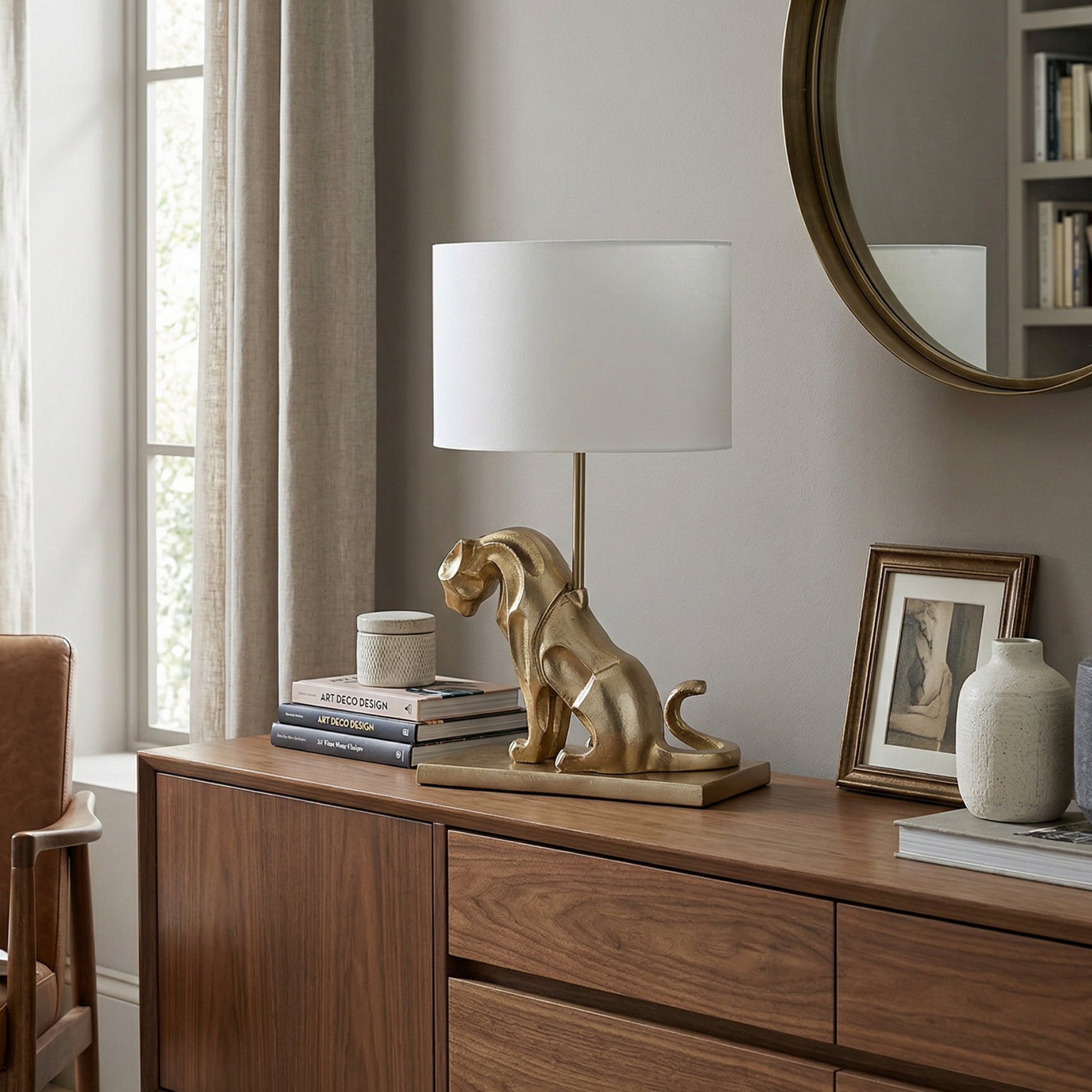Wooden sideboard with decorative items including a lamp and books in a room setting.