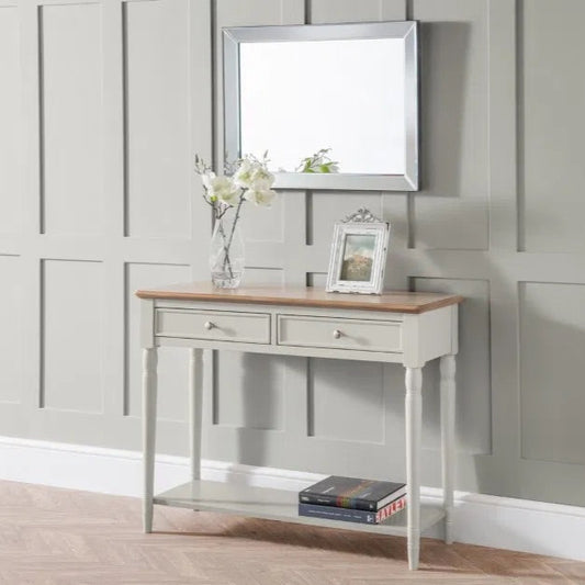 The Provence 2 Drawer Console Table in grey lacquer and limed oak effect top and classic turned legs, making it perfect for hallways or living areas. Available today at www.nobleandnook.co.uk