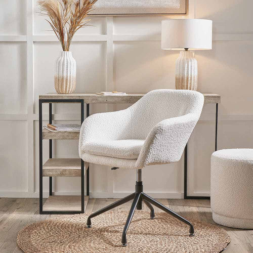Shop the Rosolini home office chair, upholstered in soft bouclé fabric, with swivel and adjustable height function for personalised comfort. Shop online today at www.nobleandnook.co.uk