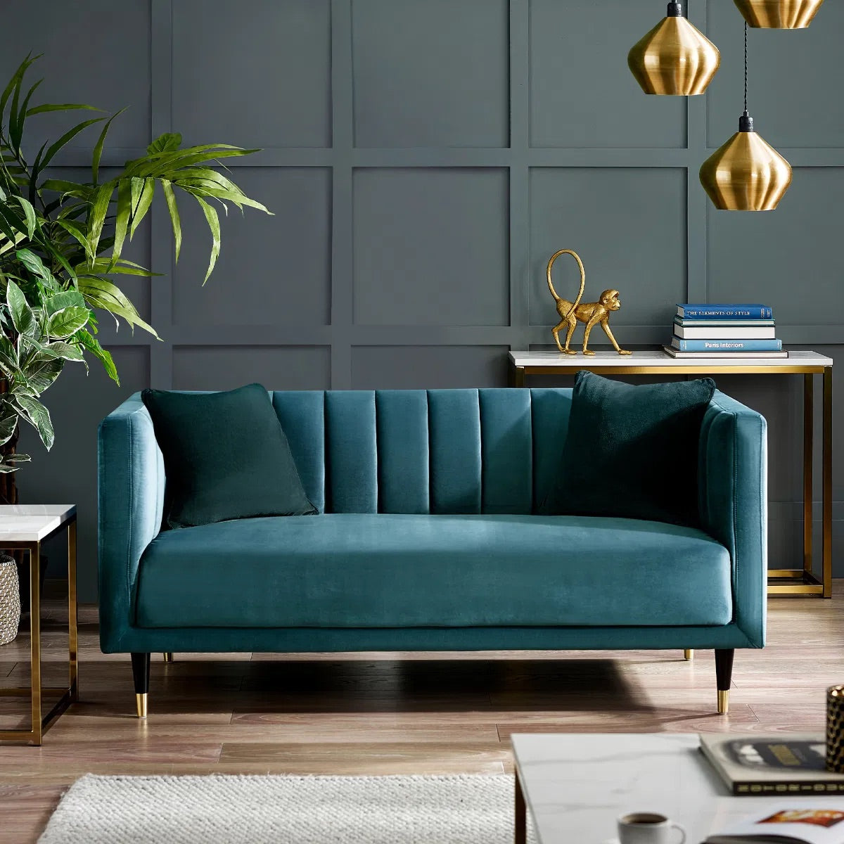 Shop the stylish scalloped sofa in soft teal velvet with fluted back design and brass tip legs. FREE UK MAINLAND DELIVERY. Shop online now at www.nobleandnook.co.uk