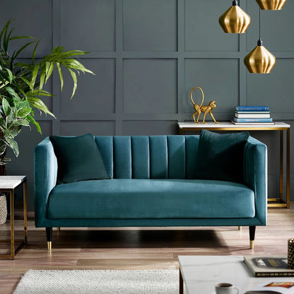 Shop the stylish scalloped sofa in soft teal velvet with fluted back design and brass tip legs. FREE UK MAINLAND DELIVERY. Shop online now at www.nobleandnook.co.uk