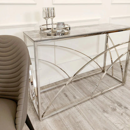 Shop now to define your interior design with this Chrome Framed art deco inspired Console Table, featuring a marble effect Sintered Stone top gold tone. Perfectly suited for hallways. Shop online today at www.nobleandnook.co.uk
