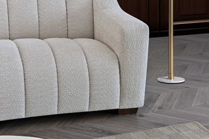 Indulge in luxury with the Aluxo Astoria 3 Seater Sofa in Oatmeal Boucle Fabric. An exquisite piece featuring deep channel stitching and adorned with a soft and alluring boucle fabric in a stunning Oatmeal hue. Shop online today at www.nobleandnook.co.uk