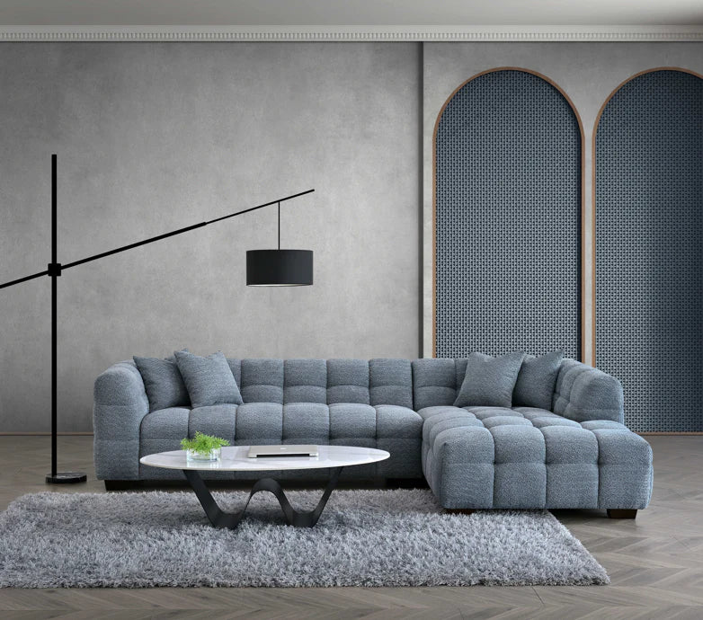 Shop the Tribeca Corner Sofa, featuring deep channel stitching and upholstered in a stunning iron boucle fabric. A modern twist on the classic Chesterfield design. Shop online today at www.nobleandnook.co.uk