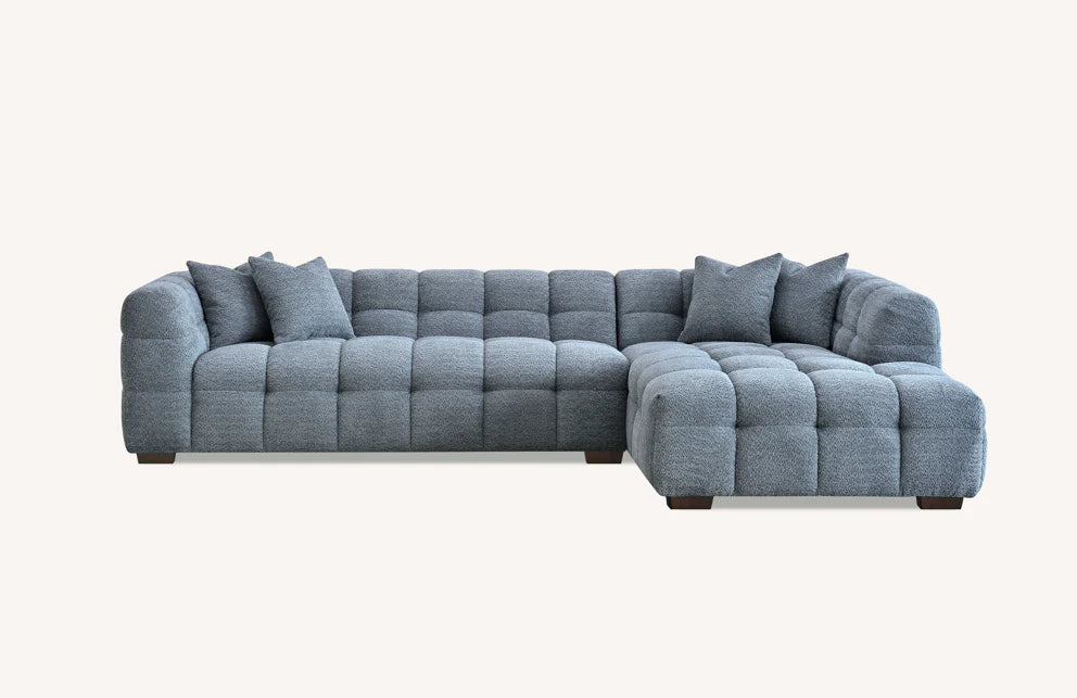 Shop the Tribeca Corner Sofa, featuring deep channel stitching and upholstered in a stunning iron boucle fabric. A modern twist on the classic Chesterfield design. Shop online today at www.nobleandnook.co.uk