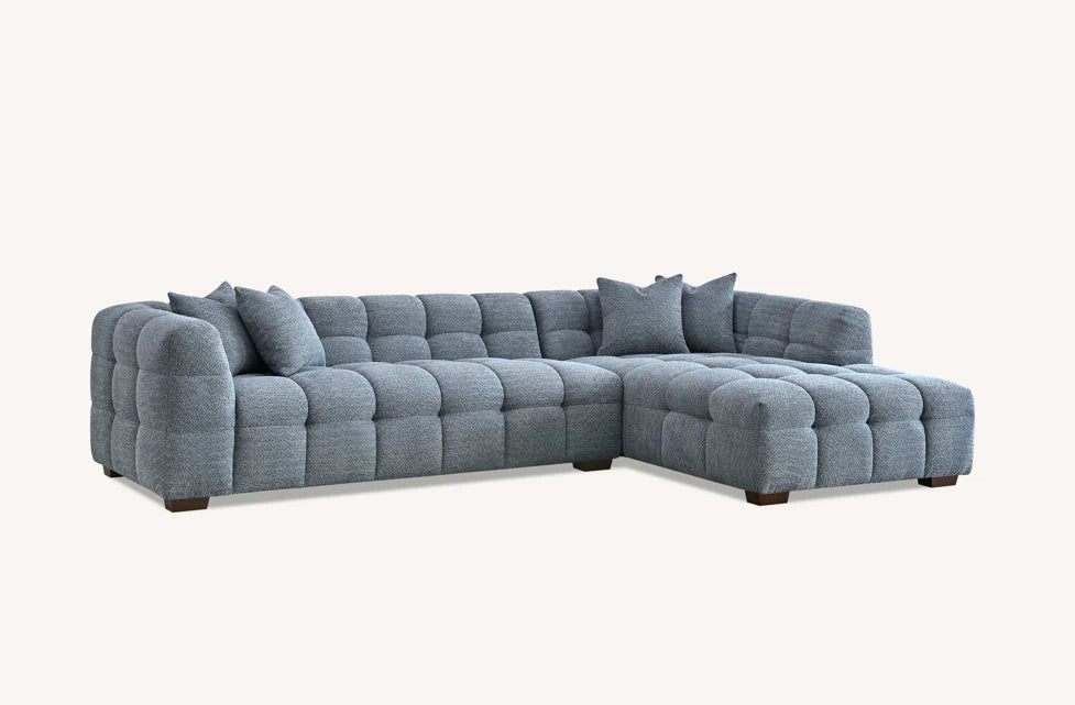 Shop the Tribeca Corner Sofa, featuring deep channel stitching and upholstered in a stunning iron boucle fabric. A modern twist on the classic Chesterfield design. Shop online today at www.nobleandnook.co.uk