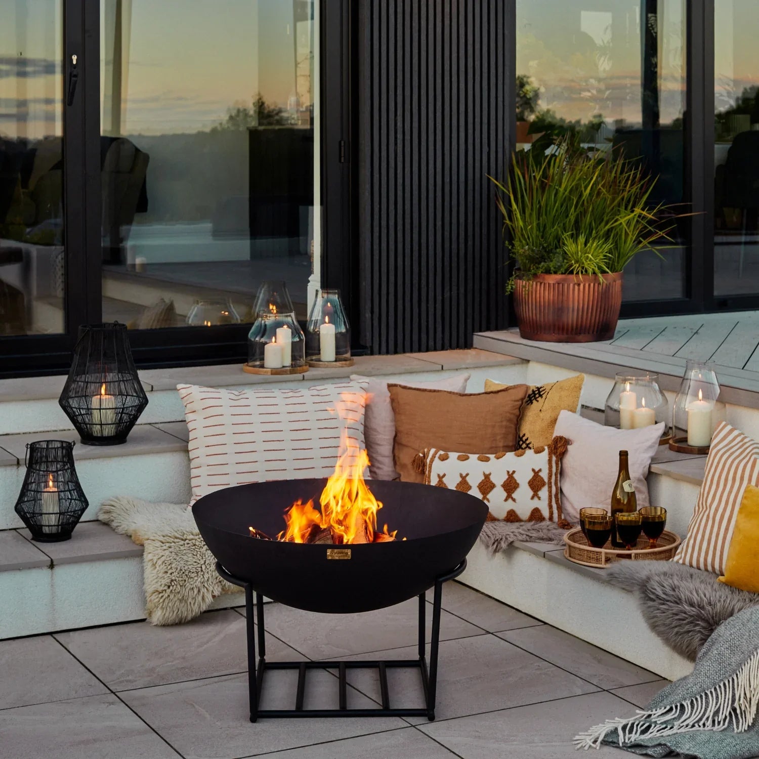 Enhance your outdoor gatherings with this medium-sized cast iron fire bowl with stand, perfect to add warmth and ambiance throughout the night. Shop online today at www.nobleandnook.co.uk