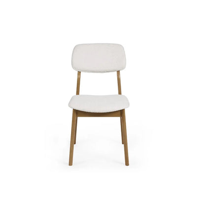Dimensions: H85 x W56 x D45 cm. Luxurious White Boucle Upholstery adds a rich, tactile finish that feels both inviting and sophisticated. Ergonomically designed for lasting comfort and support during long meals and conversations. 