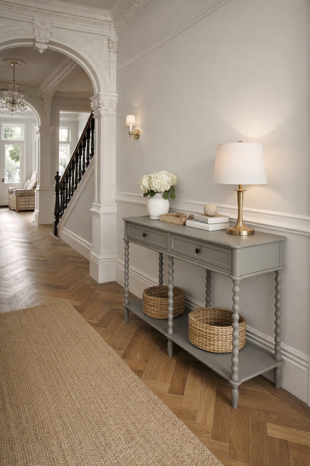 Gray console table with decorative items in a stylish hallway