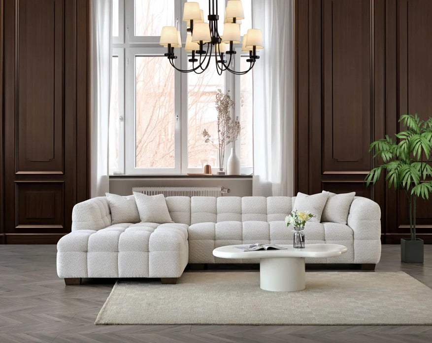Shop the Tribeca Left Hand Corner Sofa featuring deep channel stitching, upholstered in an oatmeal boucle fabric. A modern twist on the classic Chesterfield design. Shop online today at www.nobleandnook.co.uk