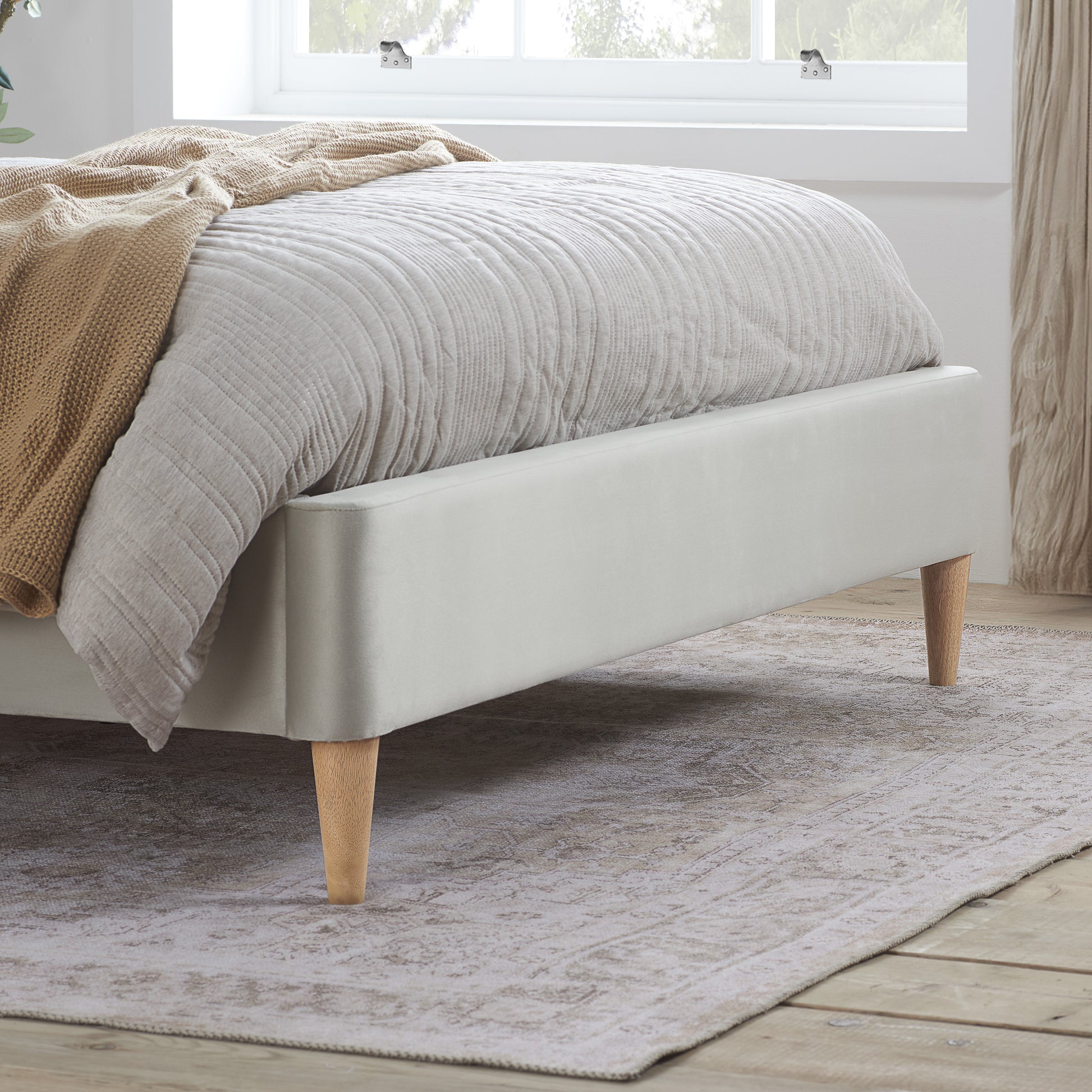 Experience luxury and comfort with this beautifully crafted king size bed frame, upholstered in warm stone grey fabric. Designed to blend timeless elegance. Shop online today at www.nobleandnook.co.uk