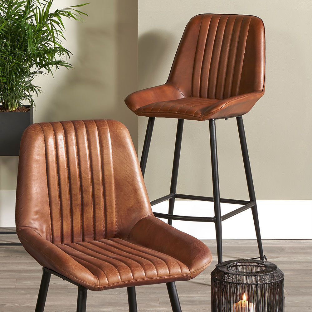 Shop our Vintage Brown Leather and Black Metal Retro Bar Stool, a perfect addition to any kitchen island or breakfast bar. FREE UK MAINLAND DELIVERY. Shop online now at www.nobleandnook.co.uk