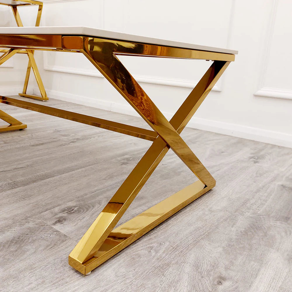 Transform your living space with this stunning coffee table with its sleek gold-finished base and pristine polar white sintered stone surface. With its clean lines and balanced form, this coffee table seamlessly complements both contemporary and classic interiors. Shop online today at www.nobleandnook.co.uk