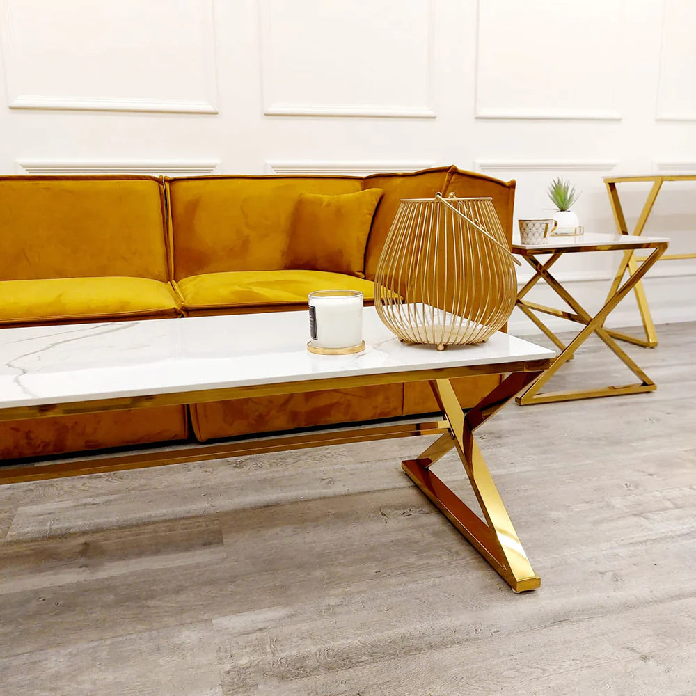 Transform your living space with this stunning coffee table with its sleek gold-finished base and pristine polar white sintered stone surface. With its clean lines and balanced form, this coffee table seamlessly complements both contemporary and classic interiors. Shop online today at www.nobleandnook.co.uk