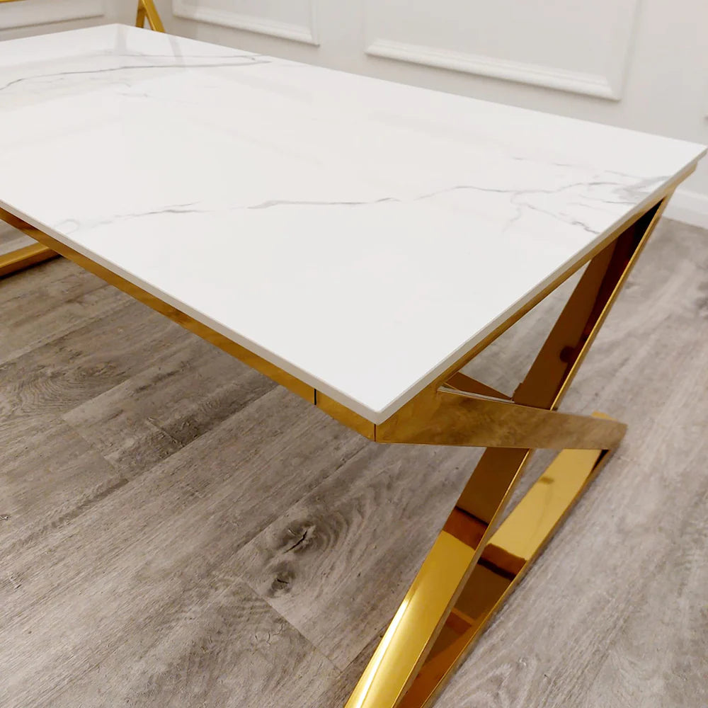 Transform your living space with this stunning coffee table with its sleek gold-finished base and pristine polar white sintered stone surface. With its clean lines and balanced form, this coffee table seamlessly complements both contemporary and classic interiors. Shop online today at www.nobleandnook.co.uk