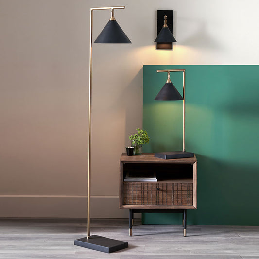 The Zeta Floor Lamp, featuring a sleek combination of matte black and antique brass metal. FREE UK MAINLAND DELIVERY. Shop online now at www.nobleandnook.co.uk