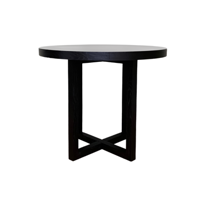 Shop the Iris Dining Table in Black Stained Oak finish with unique cross structural design which adds a touch of modern sophistication. Shop online now at www.nobleandnook.co.uk
