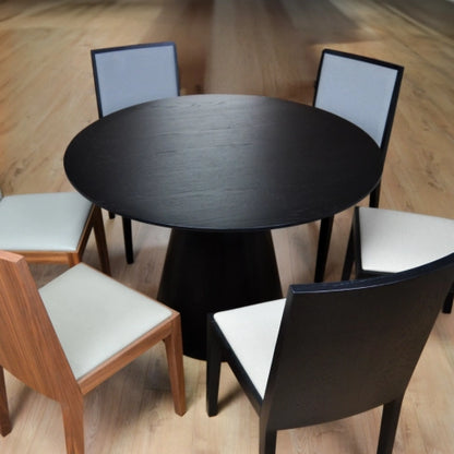 Shop the stunning Lotus Dining Table. Expertly crafted, this table is both functional and stylish with its column base and circular top. Shop online today at www.nobleandnook.co.uk