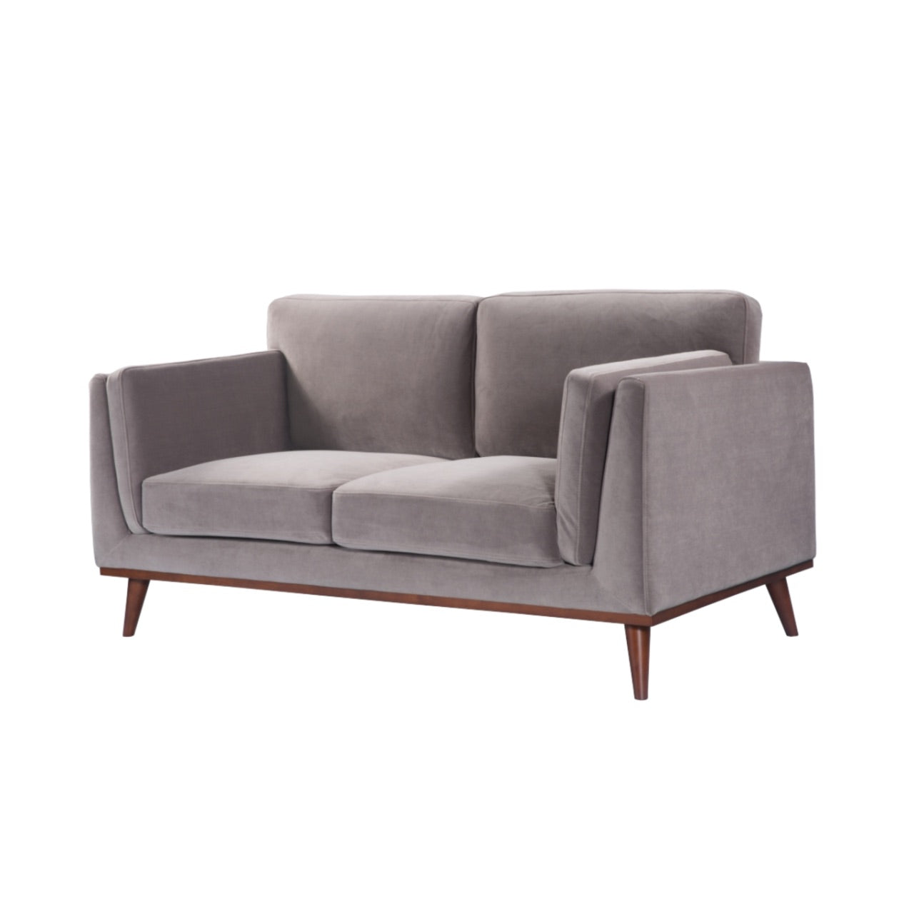 Shop the Mickey 2 seater sofa in Stone Grey velvet with a walnut frame and tapered walnut legs, a contemporary masterpiece. Shop online today at www.nobleandnook.co.uk