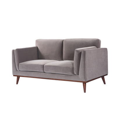 Shop the Mickey 2 seater sofa in Stone Grey velvet with a walnut frame and tapered walnut legs, a contemporary masterpiece. Shop online today at www.nobleandnook.co.uk